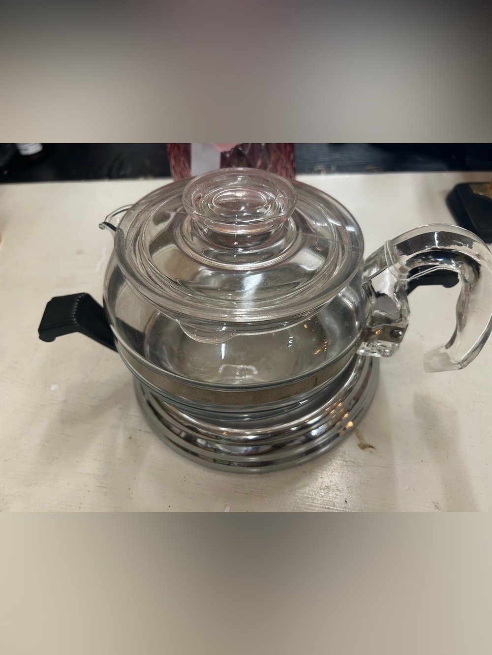 vintage Pyrex Flameware teapot, stovetop use and has a 6-cup capacity